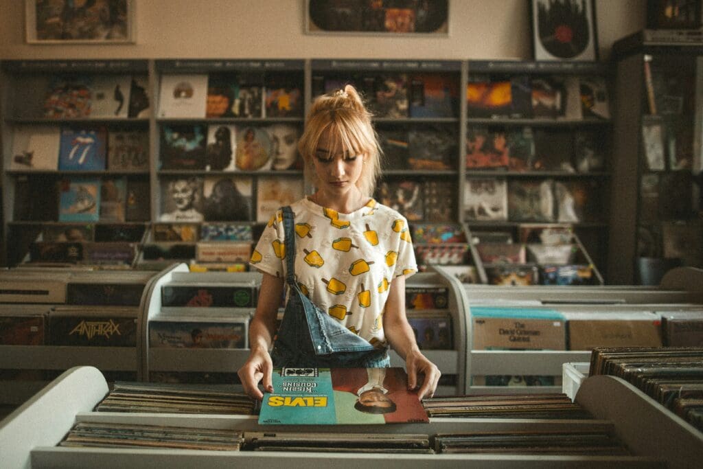 Store interior with blonde woman looking through records